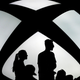 Workers stand in from of an Xbox logo waiting to see if Microsoft stands by its pro-union talk.